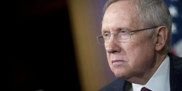 Senate Majority Leader Harry Reid, a Democrat from Nevada, listens during a news conference at the U.S. Capitol Building in Washington, D.C., U.S., on Thursday, Sept. 19, 2014. President Barack Obama's plan to arm and train Syrian rebels is poised to pass the U.S. Senate today with broad support though few predict such bipartisan spirit when Congress returns to work after the Nov. 4 election. Photographer: Andrew Harrer/Bloomberg via Getty Images 
