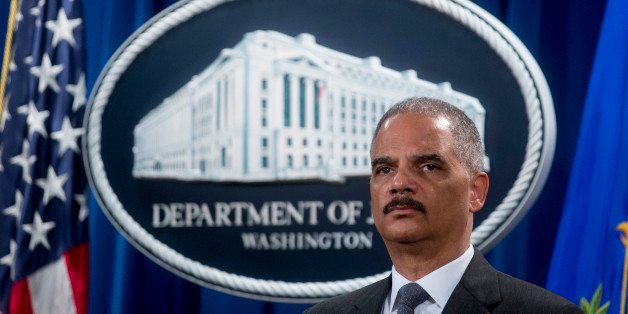Eric Holder, U.S. attorney general, listens during a news conference on Citigroup Inc. at the Department of Justice in Washington, D.C., U.S., on Monday, July 14, 2014. Citigroup Inc. and U.S. authorities announced a $7 billion agreement today to resolve a probe into sales of mortgage securities leading up to the financial crisis. The deal, signed over the weekend, requires the company to pay $4 billion to the Justice Department. Photographer: Andrew Harrer/Bloomberg via Getty Images 