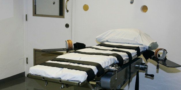 FILE - This April 15, 2008 file photo shows the gurney in the execution chamber at the Oklahoma State Penitentiary in McAlester, Okla. A lawsuit filed on behalf of 21 Oklahoma death row inmates on Wednesday, June 25, 2014, seeks to halt any attempt to execute them using the state's current lethal injection protocols, which it claims presents a risk of severe pain and suffering. (AP Photo, File)