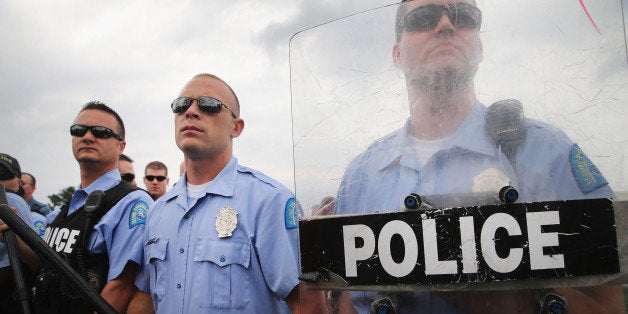 FERGUSON, MO - SEPTEMBER 10: Police block demonstrators from gaining access to Interstate Highway 70 on September 10, 2014 near Ferguson, Missouri. The demonstrators had planned to shut down I70 but their efforts were thwarted by a large contingent of police from several area police departments. Ferguson, in suburban St. Louis, is recovering from nearly two weeks of violent protests that erupted after teenager Michael Brown was shot and killed by Ferguson police officer Darren Wilson last month. (Photo by Scott Olson/Getty Images)