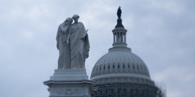 The Peace Monument memorial stands in front of the U.S. Capitol Building in this photo taken with a tilt-shift lens in Washin