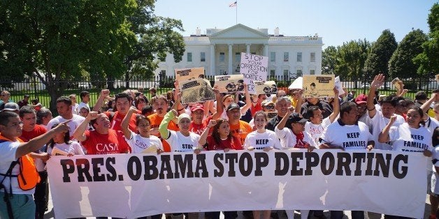 Immigrant rights activists shout slogans in front of the White House on August 28, 2014 in Washington, DC. The demonstrators are calling on US President Barack Obama to stop deportations. AFP PHOTO/Mandel NGAN (Photo credit should read MANDEL NGAN/AFP/Getty Images)