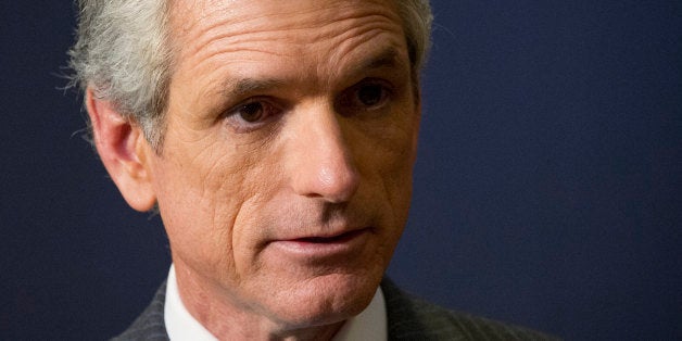 US Repiblican Representative from Virginia Scott Rigell talks to reporters on Capitol Hill in Washington on September 1, 2013