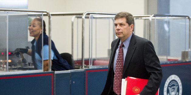 UNITED STATES - SEPTEMBER 11: Sen. Mark Begich, D-Alaska, arrives for the Senate closed briefing in the Capitol on the White House strategy on ISIL on Thursday, Sept. 11, 2014. (Photo By Bill Clark/CQ Roll Call)