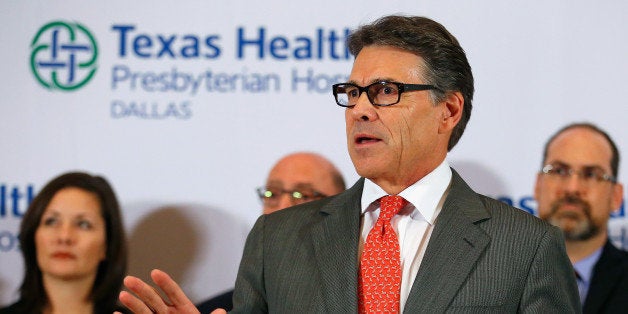 DALLAS, TX - OCTOBER 01: Texas Govenor Rick Perry answers questions related to the first confirmed case of the Ebola virus at Texas Health Presbyterian Hospital Dallas on October 1, 2014 in Dallas, Texas. State and local officials are working with federal officials to monitor other individuals that had contact with the confirmed patient. (Photo by Tom Pennington/Getty Images)