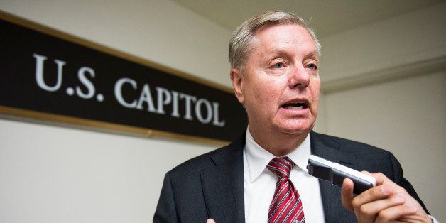 UNITED STATES - JUNE 17: Sen. Lindsey Graham, R-S.C., speaks with reporters as he arrives in the Capitol for a vote on Tuesday, June 17, 2014. (Photo By Bill Clark/CQ Roll Call)