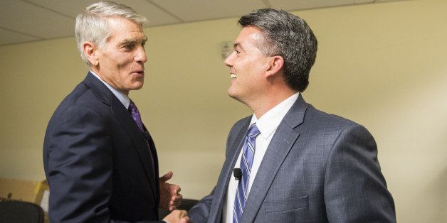 DENVER, CO - October 7: Colorado candidates for U.S. Senate, Senator Mark Udall and challenger, Representative Cory Gardner shake hands backstage before taking the stage for a debate Tuesday, October 7, 2014 in the auditorium of The Denver Post in Denver, Colorado. The debate was one of the last for the two, who according to polls are running neck to neck coming into the final weeks before the election. (Photo By Brent Lewis/The Denver Post via Getty Images)