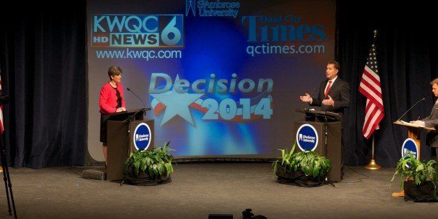 DAVENPORT, IOWA - OCTOBER 11: Republican state Sen. Joni Ernst debates U.S. Rep. Bruce Braley (D-IA) at the Galvin Fine Arts Center on October 11, 2014 on the campus of St. Ambrose University in Davenport, Iowa. The two are engaged in a closely contested senate race to filll the seat of U.S. Senator Tom Harkin (D-IA) and is considered to be one of the key races to determine control of the U.S. Senate. (Photo by David Greedy/Getty Images)