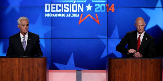 MIRAMAR, FL - OCTOBER 10: Former Florida Governor and Democratic candidate for Governor Charlie Crist (L) and Republican Flo