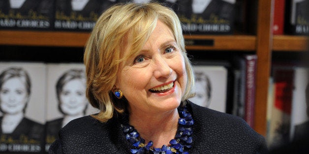 Hillary Rodham Clinton signs copies of her book Hard Choices at Books and Books on October 2, 2014 in Coral Gables, Florida.(Photo by Jeff Daly/Invision/AP)