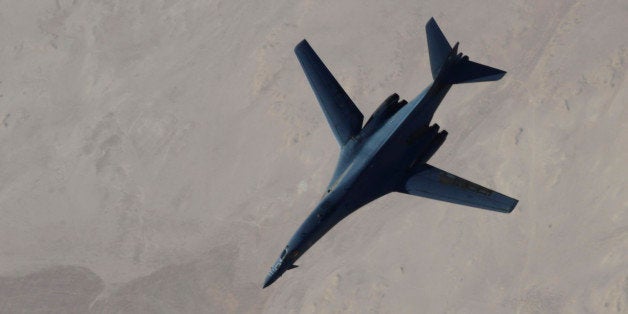 In this Saturday, Sept. 27, 2014 photo released by the U.S. Air Force, a B-1B Lancer disengages from a KC-135 Stratotanker af