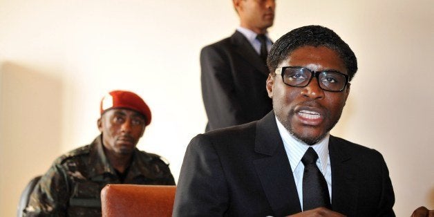 A picture taken on January 24, 2012 shows Teodoro (aka Teodorin) Nguema Obiang Mangue, (R), son of the Equatorial Guinea's President, speaking in Mbini-Rio Benito, south of Bata. French police on February 14, 2012 searched an upmarket Paris residence of the son of Equatorial Guinea's President Teodoro Obiang Nguema as part of a corruption probe, sources close to the matter told AFP. The president's son, Teodoro Obiang Mangue, was reportedly absent during the search by anti-graft police who were met with some resistance from occupants who claimed the building was protected by diplomatic immunity. AFP PHOTO / ABDELHAK SENNA (Photo credit should read ABDELHAK SENNA/AFP/Getty Images)