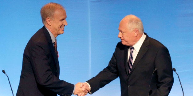 Illinois gubernatorial candidates Republican Bruce Rauner, left, and Democrat Gov. Pat Quinn greet before a debate at the DuSable Museum of African American History, Tuesday, Oct. 14, 2014, in Chicago. The debate is expected to focus on black voters. (AP Photo/Charles Rex Arbogast)