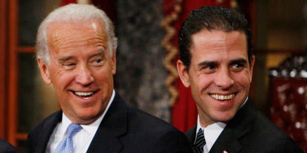 Vice President-elect, Sen. Joe Biden, D-Del., left, stands with his son Hunter during a re-enactment of the Senate oath ceremony, Tuesday, Jan. 6, 2009, in the Old Senate Chamber on Capitol Hill in Washington. (AP Photo/Charles Dharapak)