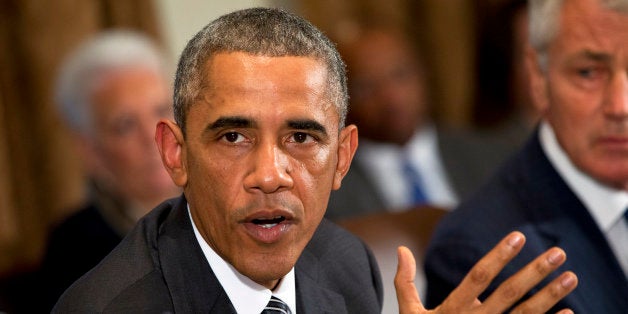 President Barack Obama speaks about Ebola after a meeting in the Cabinet Room of the White House in Washington, Wednesday, Oct. 15, 2014, with members of his team coordinating the governmentâs response to the Ebola outbreak. (AP Photo/Jacquelyn Martin)