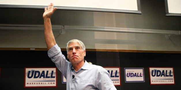 U.S. Sen. Mark Udall, D-Colo., waves to a crowd during a rally attended by U.S. Sen. Elizabeth Warren, D-Mass., to push for the Udall's reelection to the Senate, on the campus of the University of Colorado, in Boulder, Colo., Friday, Oct. 17, 2014. (AP Photo/Brennan Linsley)