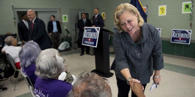UNITED STATES - SEPTEMBER 22: From right, Sen. Mary Landrieu, D-La., New Orleans Mayor Mitch Landrieu and Rep. Cedric Richmond, D-La., make their way into the Pontchartrain Park Community Center in New Orleans to speak to seniors on Monday, Sept. 22, 2014. Sen. Landrieu and her brother New Orleans Mayor Mitch Landrieu endorsed Rep. Richmond during the event. (Photo By Bill Clark/CQ Roll Call)