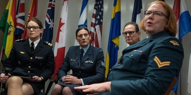 (From L to R), transgenders Major Alexandra Larsson of the Swedish Armed Forces, Sergeant Lucy Jordan of the New Zealand Air Force and Major Donna Harding of the Royal Australian Army Nursing Corps listen to Corporal Natalie Murray of the Canadian Forces speak during a a conference entitled 'Perspectives on Transgender Military Service from Around the Globe' organized by the American Civil Liberties Union (ACLU) and the Palm Center in Washington,DC on October 20, 2014. AFP PHOTO/Nicholas KAMM (Photo credit should read NICHOLAS KAMM/AFP/Getty Images)