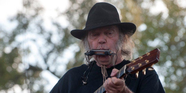 Neil Young performs at the Harvest the Hope concert in Neligh, Neb. on Saturday, Sept. 27, 2014. The concert in northeast Nebraska was organized to raise money for efforts opposing the Keystone petroleum pipeline. (AP Photo/Dave Weaver)