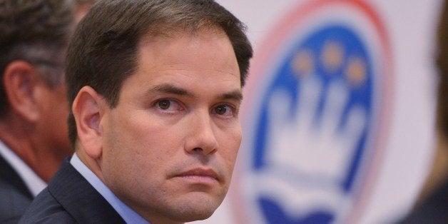 Senator Marco Rubio, R-FL, is seated before his address on the American family and cultural values.' at Catholic University on July 23, 2014 in Washington, DC. AFP PHOTO/Mandel NGAN (Photo credit should read MANDEL NGAN/AFP/Getty Images)