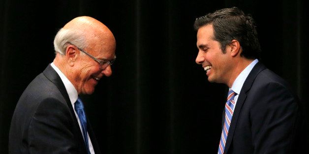 Sen. Pat Roberts, R-Kan., left, shakes hands with independent candidate Greg Orman, right, following a debate in Overland Park, Kan., Wednesday, Oct. 8, 2014. (AP Photo/Orlin Wagner)