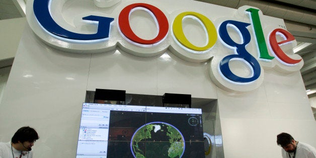 Google workers staff a booth in San Francisco, Sept. 9, 2008. Google Inc. on Thursday, Jan. 15, 2009 said it is closing three