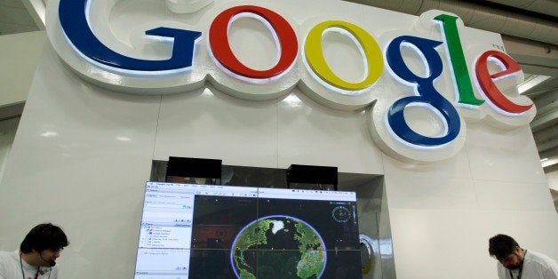 Google workers staff a booth in San Francisco, Sept. 9, 2008. Google Inc. on Thursday, Jan. 15, 2009 said it is closing three engineering offices and cutting 100 recruiters from its work force as the recession dampens hiring at the Internet search company. (AP Photo/Paul Sakuma)