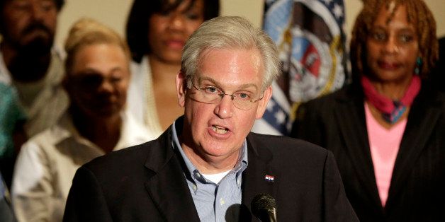 FILE - In this Aug. 16, 2014 file photo Missouri Gov. Jay Nixon speaks at a news conference in Ferguson, Mo., dealing with the aftermath of the police shooting of Michael Brown. Nixon was flying out of St. Louis around noon on Aug. 9, unaware that at that very moment a white policeman was fatally shooting an unarmed black 18-year-old just a couple of miles from where he had delivered a commencement speech. Nixon couldnât have foreseen what was about to unfold over the coming days, but questions have been raised about whether he could have responded faster. (AP Photo/Charlie Riedel, File)
