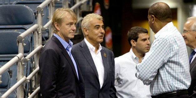 MILWAUKEE, WI - JULY 2: (L-R) Owners Wesley Edens (L) & Marc Lasry (2L) await for the official announcement of their new head coach Jason Kidd to the Milwaukee Bucks at BMO Harris Bradley Center on July 2, 2014 in Milwaukee, Wisconsin. NOTE TO USER: User expressly acknowledges and agrees that, by downloading and or using this photograph, User is consenting to the terms and conditions of the Getty Images License Agreement. (Photo by Mike McGinnis/Getty Images)