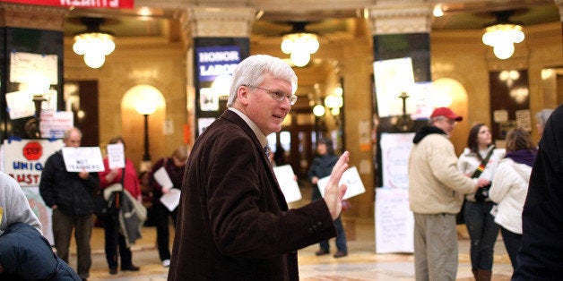 MADISON, WI - MARCH 04: Republican Wisconsin State Senator Glenn Grothman waves as he walks through the Wisconsin State Capitol on March 4, 2011 in Madison,Wisconsin. Some demonstrators have returned to the capitol building hours after they were forced to vacate the building after occupying it for more than two weeks to protest Governor Scott Walker's attempt to push through a bill that would restrict collective bargaining for most government workers in the state. (Photo by Justin Sullivan/Getty Images)