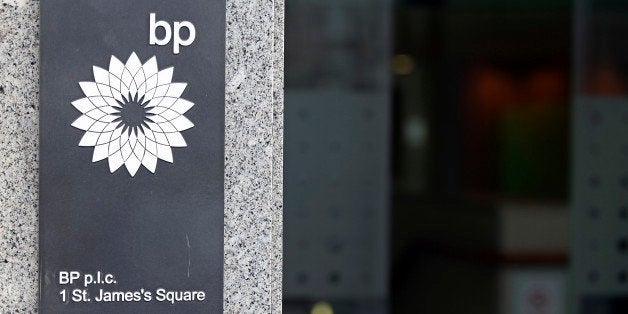 The BP Plc company logo sits on a sign outside the company's headquarters in St. James's Square in London, U.K., on Thursday, Feb. 28, 2013. BP Plc's push to maximize profits and cut costs at the Macondo well was a 'root cause' of the explosion that led to the 2010 Gulf of Mexico oil spill, a safety expert who studied the disaster said. Photographer: Chris Ratcliffe/Bloomberg via Getty Images