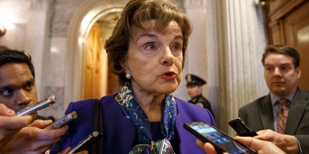 FILE - This March 11, 2014 file photo shows Senate Intelligence Committee Chair Sen. Dianne Feinstein, D-Calif. speaking to reporters as she leaves the Senate chamber on Capitol Hill in Washington. A Senate intelligence committee vote next week to release key sections of a voluminous, still-secret report on terror interrogations would start a declassification process that could severely test the already strained relationship between lawmakers and the CIA, and force President Barack Obama to step into the fray. (AP Photo/J. Scott Applewhite, File)