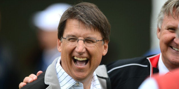 North Carolina Governor Pat McCrory enjoys a laugh at the 10th tee during the Pro-Am at Quail Hollow...