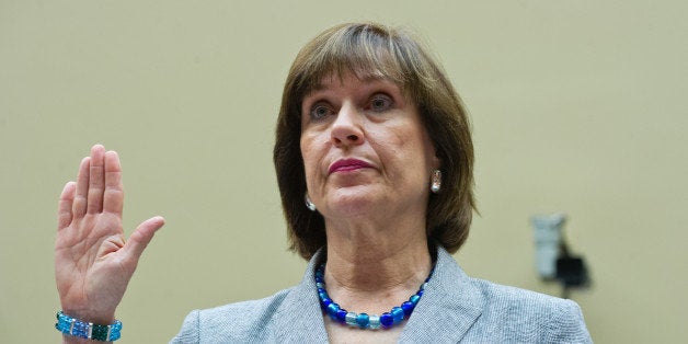 Internal Revenue Service Director of Exempt Organizations Lois Lerner(C) is sworn in before testifying to the House Oversight and Government Reform Committee May 22, 2013 in Washington, DC. The committee is investigating allegations that the IRS targeted conservative non-profit organizations with the words 'tea party' and 'constitution' in their names for additional scrutiny. Lerner, who headed the division that oversees exempt organizations, plans to assert her constitutional right not to answer questions. AFP PHOTO / Karen BLEIER (Photo credit should read KAREN BLEIER/AFP/Getty Images)