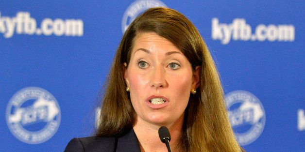 Kentucky Democratic senatorial candidate Alison Lundergan Grimes answers a question from reporters following a candidates forum at the Kentucky Farm Bureau Insurance headquarters, Wednesday, Aug. 20, 2014, in Louisville, Ky. (AP Photo/Timothy D. Easley)