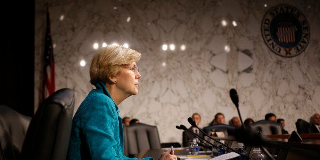 Sen. Elizabeth Warren, D-Mass., waits to questionTreasury Secretary Jacob Lew as he testifies before the Senate Banking, Housing and Urban Affairs committee during a hearing to examine the Financial Stability Oversight Council annual report to Congress on Capitol Hill in Washington, Wednesday, June 25, 2014. (AP Photo/Charles Dharapak)