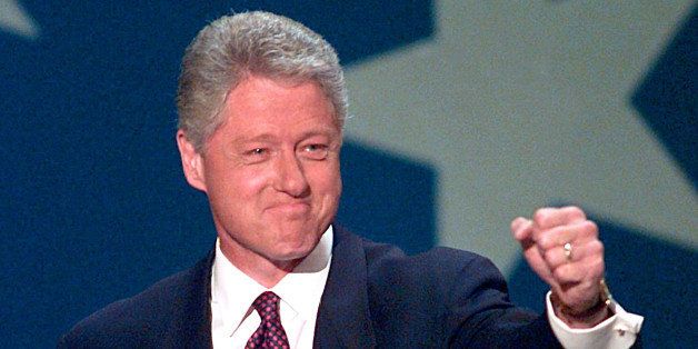 UNITED STATES - CIRCA 2000: President Bill Clinton raises his hand to the crowd before giving his acceptance speech Thursday night at the1996 Democratic National Convention at the United Center. (Photo by Harry Hamburg/NY Daily News Archive via Getty Images)