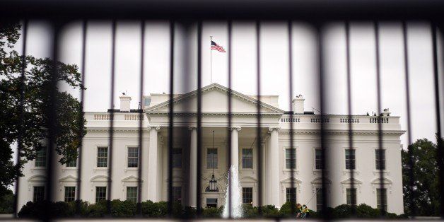 The White House is seen behind a dual layer of fencing on October 3, 2014. A new director has been appointed to head the Secret Service after a series of security breeches. AFP PHOTO/Mandel NGAN (Photo credit should read MANDEL NGAN/AFP/Getty Images)