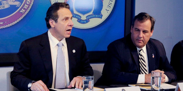 New York Governor Andrew Cuomo, left, speaks as New Jersey Governor Chris Christie listens at a news conference, Friday, Oct.