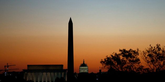 The Lincoln Memorial, left, Washington Monument, and U.S. Capitol are seen before the running of the 39th Marine Corps Marathon, Sunday, Oct. 26, 2014 in Arlington, Va. The race includes runners from 59 nations and each branch of the U.S. armed forces. (AP Photo/Alex Brandon)