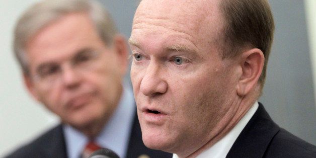 Rep. Chris Coons, D-Del., right, accompanied by Sen. Robert Menendez, D-N.J., talks about the Palestinian effort to seek UN recognition of statehood, Tuesday, Sept. 20, 2011, during a news conference on Capitol Hill in Washington. (AP Photo/J. Scott Applewhite)