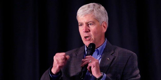 In a photo from Oct. 13, 2014, Michigan Gov. Rick Snyder is seen during a Republican rally in Troy, Mich. (AP Photo/Carlos Osorio)