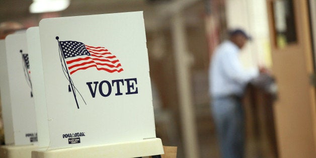 WATERLOO, IA - SEPTEMBER 27: Voting booths are set up for early voting at the Black Hawk County Courthouse on September 27, 2012 in Waterloo, Iowa. Early voting starts today in Iowa where in the 2008 election 36 percent of voters cast an early ballot. (Photo by Scott Olson/Getty Images)