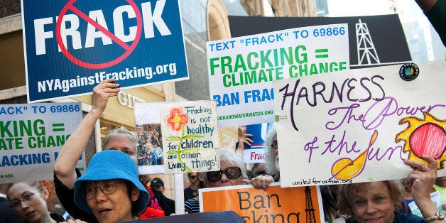 NEW YORK, NY - SEPTEMBER 23: Anti-fracking demonstrators protest on 51st Street and 7th Avenue as President Obama arrives at the Sheraton Hotel, at 52nd Street, on September 23, 2014 in New York City. As the UN General Assembly begins, demonstrators have taken the opportunity to protest in front of the 140 heads of state expected to be in New York, NY. (Photo by Bryan Thomas/Getty Images)