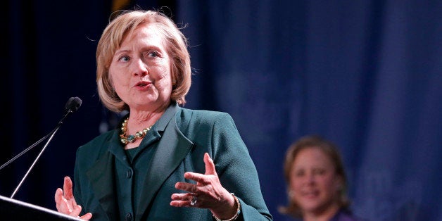 Former Secretary of State Hillary Clinton speaks at a campaign event for Sen. Mary Landrieu, D-La., background, in New Orleans, Saturday, Nov. 1, 2014. (AP Photo/Gerald Herbert)