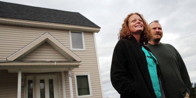 FORT KENT, ME - OCTOBER 31: Kaci Hickox stands with her boyfriend Theodore Michael Wilbur as she gives a statement to the m