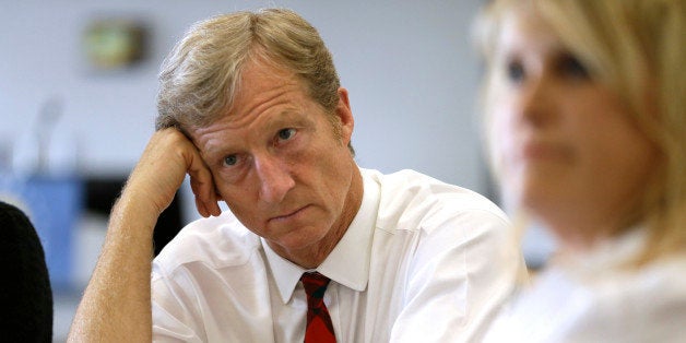 Businessman Tom Steyer listens during a meeting to announce the launch of a group called Virginians for Clean Government at Virginia Commonwealth University in Richmond, Va., Wednesday, Sept. 25, 2013. The group was formed to explain the impact of CONSOL Energy not paying royalties to their family and neighbors as well as speaking out against Ken Cuccinelli's acceptance of $111,000 in CONSOL contributions. (AP Photo/Steve Helber)