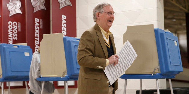 Senate Minority Leader Mitch McConnell, R-Ky., casts his ballot in the midterm election at the voting precinct at Bellarmine University in Louisville, Ky., Tuesday, Nov. 4, 2014. The Kentucky U.S. Senate race, with McConnell, a 30-year incumbent, facing a spirited challenge from Democrat Alison Lundergan Grimes, has been among the most combative and closely watched contests that could shift the balance of power in Congress. (AP Photo/J. Scott Applewhite)