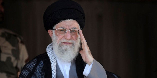 In this picture released by an official website of the office of the Iranian supreme leader, Supreme Leader Ayatollah Ali Khamenei, center, attends a graduation ceremony of army cadets, in Tehran, Iran, Saturday, Oct. 5 2013. Iran's top leader hinted Saturday that he disapproved of the phone call between Presidents Hassan Rouhani and Barack Obama during the Iranian leader's trip to New York last month, but he reiterated his crucial support for the president's policy of outreach to the West. (AP Photo/Office of the Iranian Supreme Leader)