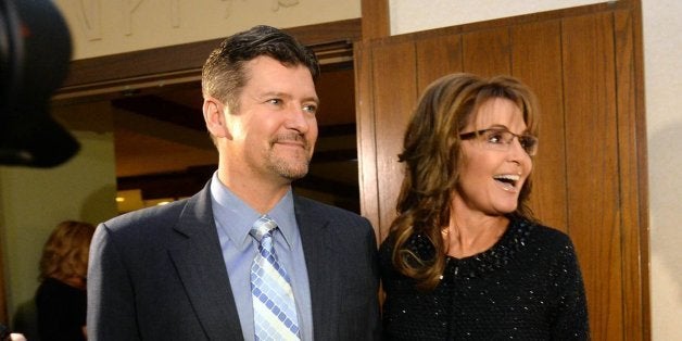 Sarah Palin, right, former Governor of Alaska, and her husband, Todd, arrive at the Grove Park Inn for a celebration of Billy Graham's 95th birthday in Asheville, N.C., on Thursday, Nov. 7, 2013. (Todd Sumlin/Charlotte Observer/MCT via Getty Images)